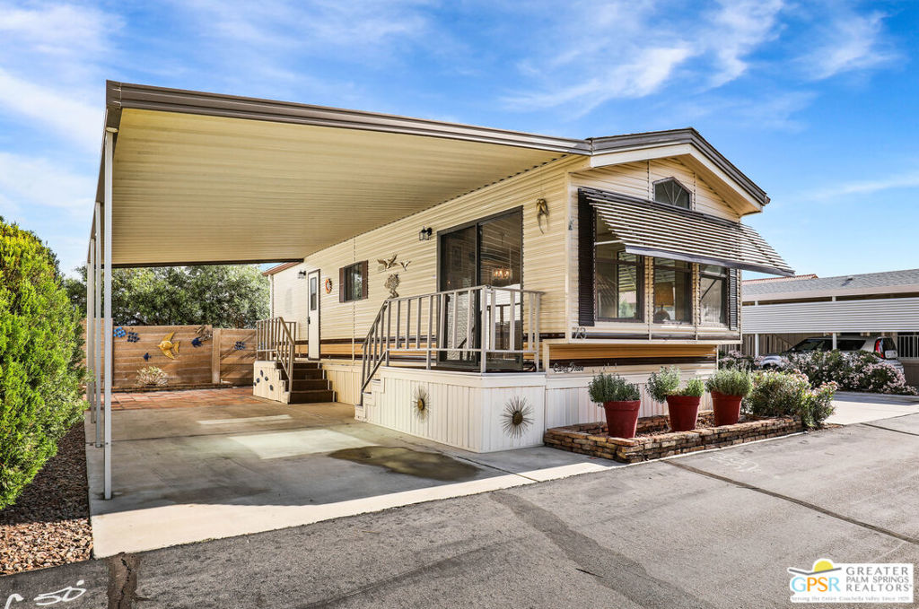 Desert Retreat Awaits - Tiny Home with Big Potential in 55+ Sungate Community! Welcome to Sungate, a vibrant 55+ senior community nestled at the foot of a stunning mountain range just two blocks from Agua Caliente Casino! This charming tiny home is move-in ready and brimming with potential for your personal updates and finishing touches. Step into an open-concept living area designed for ease and efficiency, featuring an abundance of natural light, a ceiling fan, and an inviting slider that connects seamlessly to the kitchen. Cook up something special with a propane range, newer refrigerator, and built-in microwave, all thoughtfully arranged to maximize function. The cozy 1 bedroom includes mirrored closet doors, built-in drawers, and built-in dresser drawers, offering both comfort and flexibility. Outside, enjoy a spacious covered carport with room for two cars parked tandem-style and ideal for relaxation, entertaining, or extra storage. Looking to expand your vision? Sungate's resort-style amenities include two sparkling pools, soothing hot tubs, on-site laundry, a library, and a lively community center with regular events. With an incredibly low Indian land lease of just $110.10/month and an HOA fee of only $232/month, this is an affordable opportunity you won't want to miss. Ideally located near Palm Springs International Airport, shopping, grocery stores, the Rancho Mirage Ritz Carlton, and iconic Frank Sinatra Drive, everything you need is right at your fingertips. Opportunities like this are rare! Schedule your private showing today and unlock the desert lifestyle you've been dreaming of!