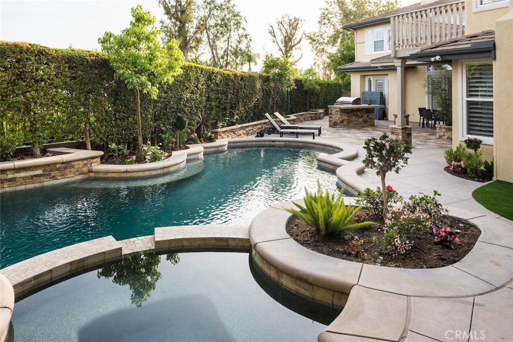 Elegant home on 11,022 sf lot , 4345 ft house with a swimming pool and spa at gated community in Northwood Point, Irvine. It located at a Cul-De-Sac and back to hiking Trail. No traffic near the house. With paid solar panels, you get huge savings on electricity bills. 6 bedrooms plus a bonus room or office and a loft area , 4.5 bathroom with a full guest suite downstairs, 3 fireplaces at 4345 sf, 3 car garage with a separate AC, can be used a gym. High quality and finest materials/craftsmanship remodeling make this house beautiful. This home is a designer's master piece with a timeless theme of elegant clear straight lines and graceful colors. Living and dinning Rm have dramatic high ceilings. Master suite has an added view deck. A chef’s dream kitchen. Family Room has extensive built ins. Designer's expensive distressed hardwood floor and customer made handrails through out. Designer's patterned tiles in wet areas. Customer crafted high quality built ins and crown moldings and plantation shutters through out. Sliding frost glass fusion closet doors through out. Whole house LED lights through out. All windows and French doors are double pane, 8 ceiling fans. Resort like back yard with covered patio, swimming pool, spa, water slide, built-in BBQ, and expensive artificial grass for easy maintenance. Walking distance to famous Award winning Canyon View Elementary school and Northwood High School. HOA also includes a community pool with additional amenities of tennis, sand volleyball, BBQ pavilions, hiking trails, parks and basketball court . Easy access to 5, 405, world class shopping and restaurants.