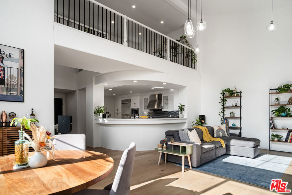 Welcome to Unit 425, "The Great Retreat," a truly exceptional top-floor home in Playa Vista. This residence stands out among the community's thousands of units due to its premium location, unique floor plan with minimal shared walls, and high-end renovation. This home was recently renovated with the love and care of a homeowner, not a flipper, featuring nearly $150,000 in upgrades. No detail was overlooked, from the premium White Oak engineered wood floors and beautifully updated kitchen and bathrooms to custom, remote-controlled window treatments and hand-blown pendant lights. The residence is also fully equipped with smart technology, including a smart lighting system to customize the ambiance, a Nest thermostat, KwikSet door lock, and a Ring doorbell with speakers on all floors. Unlike many condos that share 60% of their walls with a neighbor, this unit shares only about 10%. Fewer shared walls means more sunlight, greater privacy, and less noise. As a top-floor unit, it benefits from uniquely high ceilings, creating an airy, sunlit space. The southern-facing direction ensures abundant natural light floods the home throughout the day. Located in the desirable Serenade building, this is one of the most walk-friendly addresses in Playa Vista. You are literally steps away from Concert Park and the community's most charming commercial district: a summer concert, a beer, or a cup of coffee is just a few steps away. The Serenade complex itself is an oasis, boasting Mediterranean and Tuscan-style architecture. With lush gardens, multiple water fountains, and airy corridors, the complex feels like a vacation getaway. Importantly, this is also one of Playa Vista's best-maintained and financially healthiest buildings, with a funded reserve of nearly 80%. Unit 425 is truly your retreat: offering the best location, high-end finishes, and a rare sense of peace and quiet. Other Notes: The 3rd bedroom is a loft. In-unit laundry, 2-car tandem parking, central heating and cooling, shared electric car charger. Tax records state 1,740 sqft.