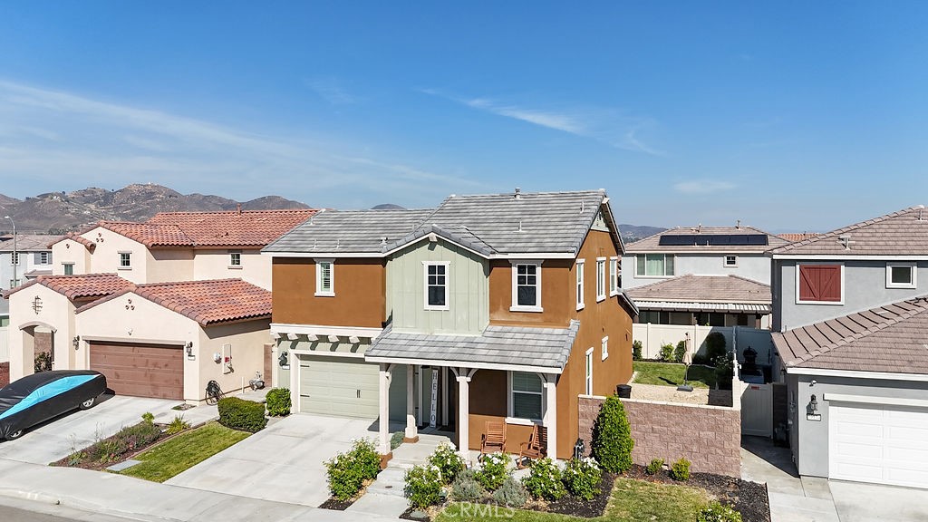 Welcome to Your Dream Home in the Desirable Summerly Community of Lake Elsinore! Step into modern farmhouse elegance with this beautifully upgraded 4-bedroom, 3-bathroom home located in the sought-after Summerly community. Designed with comfort and style in mind, this home offers the perfect blend of functionality and charm—ideal for families and entertainers alike. As you arrive, you're greeted by fresh landscaping, vibrant roses, and a cozy front porch—perfect for relaxing with your morning coffee. Inside, luxury vinyl plank flooring flows seamlessly throughout the home, complemented by classic plantation shutters for a timeless aesthetic. The main floor features a private bedroom and a convenient ¾ bath, perfect for guests or multigenerational living. Continue down the hall to the open-concept living space where the family room, dining area, and chef’s kitchen come together in perfect harmony. The spacious kitchen boasts a nice island for meal prep and gathering, stainless steel appliances, and a generous walk-in pantry for all your storage needs. Sliding glass doors open to a beautifully landscaped backyard—an ideal setting for outdoor dining and entertaining. Upstairs, retreat to your spacious primary suite complete with a custom sliding barn door that opens to the ensuite bathroom. A Jack-and-Jill bath connects the additional two bedrooms, and the upstairs laundry room adds convenience to daily life. The Summerly community offers resort-style amenities including sparkling pools, relaxing jacuzzis, playgrounds, sports courts, a community fireplace, outdoor
cooking areas, and expansive greenbelts for children and pets to enjoy. Plus, you're just minutes from Lake Elsinore, offering boating, fishing, and water activities year-round. Don’t miss this rare opportunity—schedule your private showing today!