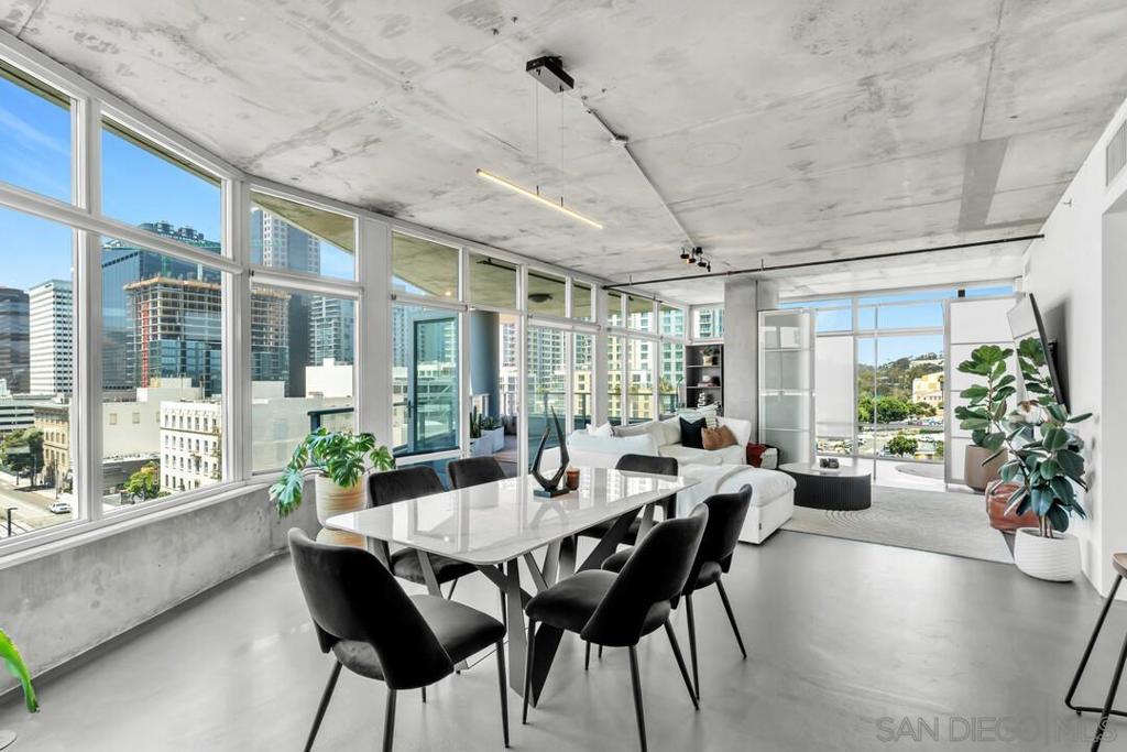 This expansive corner unit offers 2 bedrooms, 2 bathrooms, and 1,328 square feet of modern living in the heart of downtown San Diego’s East Village. With floor-to-ceiling windows, the home is filled with natural light and showcases sweeping city and Balboa Park views. The open-concept layout leads to a private balcony, perfect for entertaining or enjoying the skyline. Enjoy top-tier amenities including an on-site gym and an incredible rooftop deck featuring panoramic views, BBQ grills, and a spa. The unit includes two side-by-side assigned parking spaces in a secured garage, an increasingly rare feature downtown. Located just steps from Petco Park, the Gaslamp Quarter, UCSD’s downtown campus, and the trolley, this home delivers on walkability, lifestyle, and location. VA approved and move-in ready, ideal for first-time buyers, investors, or anyone seeking the best of downtown living. This expansive corner unit offers 2 bedrooms, 2 bathrooms, and 1,328 square feet of modern living in the heart of downtown San Diego’s East Village. With floor-to-ceiling windows, the home is filled with natural light and showcases sweeping city and Balboa Park views. The open-concept layout leads to a private balcony, perfect for entertaining or enjoying the skyline. Enjoy top-tier amenities including an on-site gym and an incredible rooftop deck featuring panoramic views, BBQ grills, and a spa. The unit includes two side-by-side assigned parking spaces in a secured garage—an increasingly rare feature downtown. Located just steps from Petco Park, the Gaslamp Quarter, UCSD’s downtown campus, and the trolley, this home delivers on walkability, lifestyle, and location. VA approved and move-in ready—ideal for first-time buyers, investors, or anyone seeking the best of downtown living.