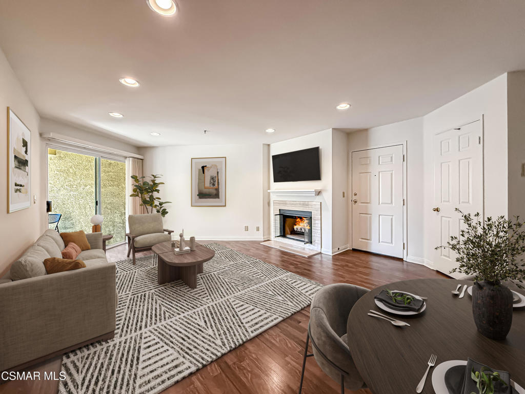 This end unit condo on the ground floor is move-in ready with fresh paint, new carpeting, woodlike flooring and lots of recessed lighting. This is the first time this home has been on the market since the original owner specifically choose this peaceful location adjacent to the walking path leading to the tennis courts & other outdoor amenities. This 2 bedroom, 2 bathroom condo offers an open concept living & dining area with a cozy fireplace and access to a spacious patio. The galley kitchen has a large pantry with convenient pull-outs for easy storage. The primary suite has a well designed walk-in closet that accommodates lots of clothing & extra shelving for shoes or your special folded items. The laundry closet/utility room is ideally located on the private patio adjacent to the primary bedroom. The large second bedroom offers a good sized closet & access to the larger patio that is shared with the livingroom. Enjoy the recently replaced heating & the whisper quiet Bosch AC system. Shadow Ridge offers resort-style living with a tremendous selection of ammenities including two pools, sauna, gym, clubhouse, tennis & racquetball courts & an on-site property manager. The low HOA fees includes cable, and fire & earthquake insurance. Shadow Ridge provides easy access to top-rated schools, shopping, resturants & scenic hiking trails.