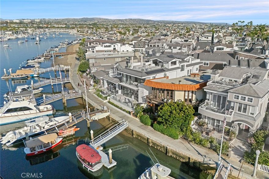 Amazing Balboa Island Waterfront Opportunity on the Bay and Boardwalk with its own Private Dock. This treasured family home at the "Quiet End" of Balboa Island presents a rare 35-foot-wide Bayfront lot, including 3 bedrooms, 3 baths, and a possible 4th bedroom on the first floor. From both inside and outside the home, there are unparalleled water views at any time of day, but the sunset view towards Beacon Bay from the second-floor balcony is absolutely breathtaking. The expansive front patio is a verdant oasis, complete with lush landscaping, a mature magnolia tree, fountain, and plentiful seating options. Both the first and second levels of the home take advantage of the lot's superior width and feature spacious living areas with fireplaces. The private boat dock has slips for 2 boats and is another outstanding aspect of the home. Enjoy the abundant coastal charm of this unique home on enchanting Balboa Island.