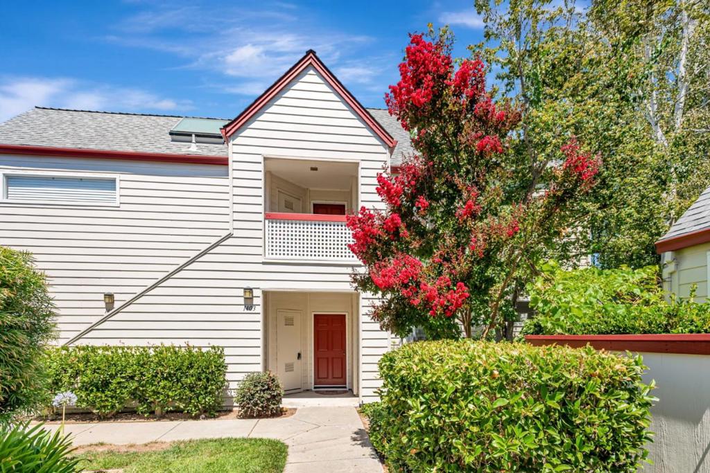 Welcome to a rare opportunity in the coveted Park Atherton Lake community, Redwood City's best-kept secret. This beautifully ground-floor end unit feels more like a private retreat. Step inside to discover a thoughtfully updated interior featuring wide-plank luxury vinyl flooring. The open-concept layout seamlessly connects the living and dining areas to a private deck where you'll be captivated by peaceful views of the lake, dancing fountains, and soaring redwood trees. The expansive primary suite is your retreat, complete with a generous walk-in closet and sliding glass doors that open directly to a secluded backyard oasis with a Lemon Tree. A second bedroom, also with direct access to the backyard, offers flexibility for guests, a home office, or creative space. This home comes with a detached one-car garage for secure storage, plus an additional assigned parking space for added convenience. Enjoy an array of exclusive resident amenities, including a swimming pool, spa, sauna, tennis court, and a clubhouse, boutique shopping, theaters, and cultural entertainment. Close to shopping and transportation.