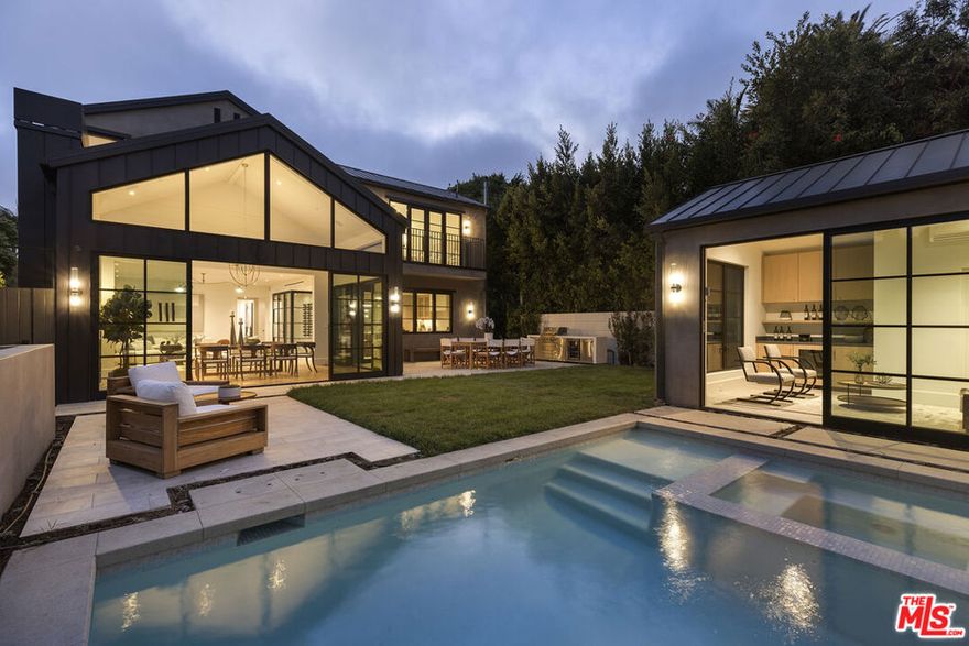 Discover luxury in this brand new construction in West Hollywood, meticulously designed with every amenity in mind. This stunning residence spans three levels, featuring 5 spacious bedrooms and 8 elegant bathrooms, exemplifying superior quality and contemporary opulence. The kitchen boasts exquisite Calacatta Viola marble and a La Cornue range, among other high-end appliances. Craftsmanship is evident throughout, with an elegant herringbone design adding refinement.The primary bedroom is a sanctuary with an expansive walk-in closet and a private bath. The lower level is an entertainment oasis, with a chic bar area, state-of-the-art movie theater, gym, and guest bedroom. Fully integrated with Control4 Smart Home technology, manage lighting, security, and entertainment effortlessly. The outdoor area features a pool and stunning pool house with a bar area and bathroom. This entertainer's dream home provides the perfect setting for relaxation and social gatherings. With its prime location and unmatched amenities, it stands as a testament to opulent living. Not Subject to Measure ULA.