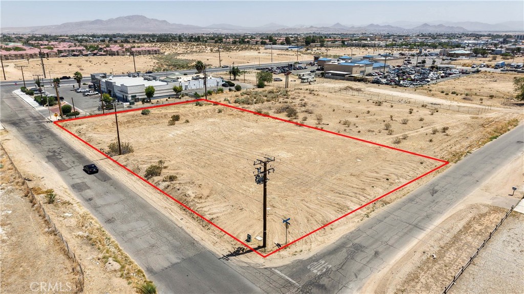 Opportunity knocks with this exceptional corner lot located just behind a bustling commercial shopping center. Located right behind the Dollar General South side on Palmdale Road. This lot is a full 1.13 ACRES. Whether you're looking to build your dream home, start a new business, or invest in an area with high potential, this land offers endless possibilities. The land is zoned vacant, with utilities nearby on a paved road for easy connection. It’s an ideal location with high potential for future growth. Buyers are encouraged to conduct their own due diligence with the county regarding zoning and utilities. Conveniently located near the I-15 freeway and its exit ramp, this lot offers quick access to major highways, making it an attractive opportunity in a high-demand area. Whether you're looking to develop now or hold for future growth, this lot is primed for success. This is a high-demand area and opportunities like this don’t last long!