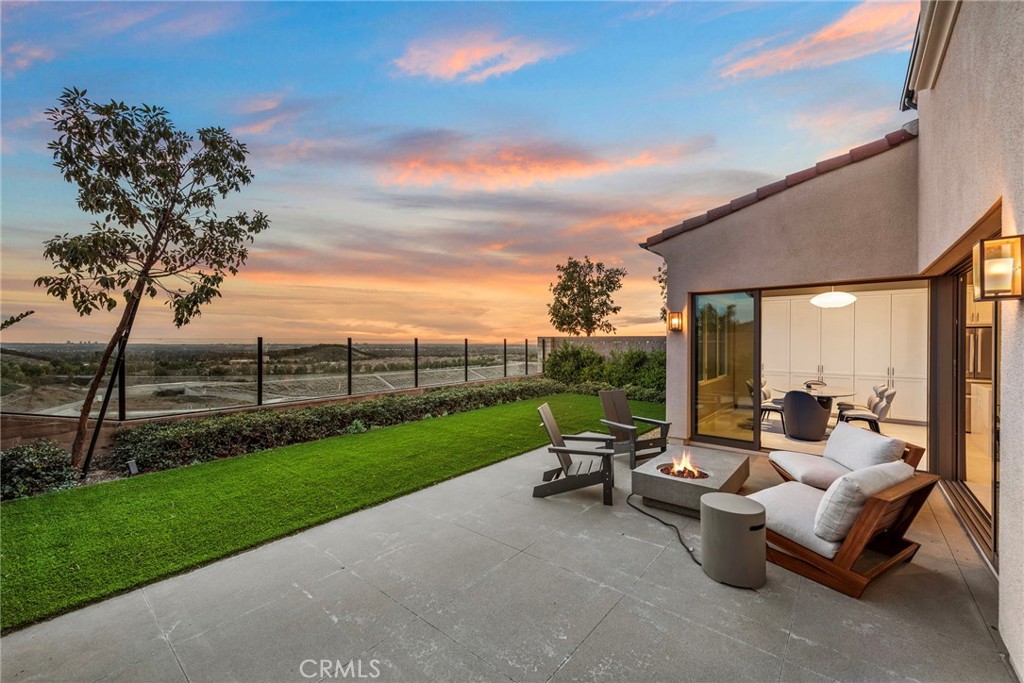 Located in the prestigious guard-gated community of Orchard Hills, this beautifully upgraded residence offers sweeping panoramic views—from sparkling city lights to the distant Catalina Island—enjoyed from the privacy of your own backyard. The 3-bedroom, 2.5-bath layout is thoughtfully designed to balance comfort and functionality, ideal for modern living. Throughout the home, you’ll find high-end custom upgrades, including: • Premium hardwood flooring • Waterfall-edge kitchen island • Motorized Lutron shades, offering seamless smart control and privacy • Designer lighting fixtures • Smart security system with remote monitoring …and more. This home has been meticulously maintained and tastefully styled. A full suite of luxury furnishings may be included in the sale, providing a true turnkey opportunity. Residents enjoy resort-style amenities, 24-hour gated security, low HOA and Mello-Roos, and access to Irvine’s award-winning schools, including the highly ranked Northwood High School. Don’t miss this rare opportunity to own a view home in one of Irvine’s most desirable neighborhoods.