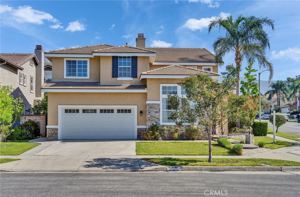 A Rare Corner-Lot Masterpiece with Over $150K in Designer Upgrades.
Nestled in the prestigious Alta Loma foothills, this exquisitely renovated corner-lot home sits on a spacious 6,850 sq. ft. lot, offering approximately 2,356 sq. ft. of elegant living space. The expansive three-car tandem garage features custom cabinetry, providing abundant storage and seamless organization.
Step through a dramatic foyer graced with soaring ceilings and a sparkling crystal chandelier, unveiling a bright, open-concept floor plan that effortlessly blends formal and casual living. Designer finishes and abundant natural light throughout create a warm and inviting atmosphere—perfect for both everyday comfort and entertaining guests.
The chef’s kitchen is a culinary dream, outfitted with custom cabinetry, gleaming quartz countertops, an undermount sink with a premium faucet, and top-of-the-line appliances including a built-in LG refrigerator, Fotile range hood and gas stove, LG oven, built-in wine cooler, and a convenient water filtration system.
Upstairs, a versatile loft offers flexible space ideal for a media room, study, or home office. The luxurious primary suite features a generous walk-in closet and spa-inspired bathroom with dual quartz vanities, a frameless glass shower, and a freestanding soaking tub. All bathrooms showcase porcelain tile floors, Moen® rainfall showerheads, American Standard fixtures, and custom mirrors—where style meets functionality.
Designed for seamless entertaining, the backyard boasts premium artificial turf, a covered patio, and a built-in BBQ island—ideal for year-round gatherings. Recent upgrades include fresh exterior paint (2025) and a new motorized garage door.
Enjoy convenient access to the 210 Freeway, Vineyards Marketplace, Kenyon Park, scenic hiking trails, and Victoria Gardens Mall for shopping, dining, and entertainment. The historic Cucamonga Service Station, a beloved Route 66 landmark, is just minutes away.
Located within top-rated school zones, move-in ready home perfectly combines designer upgrades with a prime location in one of Rancho Cucamonga’s most coveted neighborhoods.
Discover the details in person—contact us for an exclusive private tour.