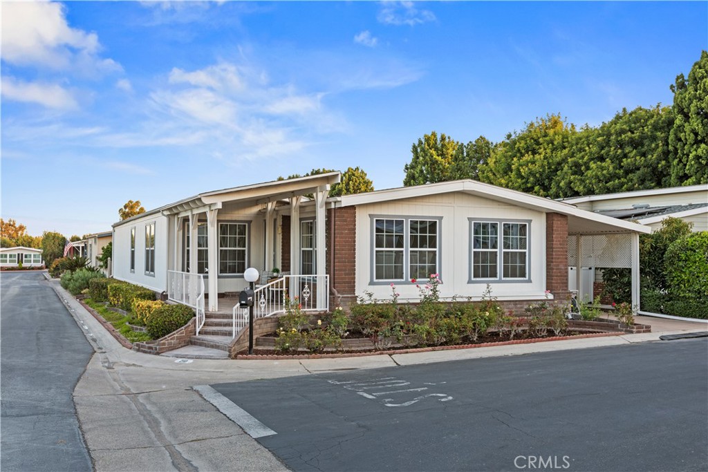 Welcome to The Groves, Irvine’s premier 55+ gated community where lifestyle meets luxury. There is NO space rent, just land ownership. This stunning 2-bedroom, 2-bathroom home with an office has been thoughtfully updated to blend modern finishes with timeless comfort. Step inside and be greeted by a bright, open floor plan with soaring raised ceilings in the living and dining rooms. Sunlight pours through the skylight and expansive windows, filling every corner with natural warmth. The gourmet kitchen is a chef’s dream, featuring crisp white shaker cabinets, double ovens, a gas cooktop, stainless steel microwave and dishwasher, and plenty of prep space for entertaining. Elegant LVP flooring runs throughout, complementing the home’s modern updates including recessed lighting, drywalled ceilings, and ceiling fans for year-round comfort. The bathrooms have been beautifully refreshed, and the additional family room and casual dining area provide plenty of flexible living space. Enjoy your morning coffee or evening glass of wine on the large stone front porch, where you can take in views of the lush lawn bowling greens and the inviting clubhouse just steps away. The Groves Lifestyle...
Living here means more than just owning a home, it’s about joining a vibrant community. The Groves offers unbeatable value. Amenities include:Recently renovated year-round heated pool & spa, gym, and sauna, pickleball, tennis, basketball, lawn bowling, and putting green, expansive clubhouse with banquet facilities, lounges, and game rooms, creative spaces including a ceramics studio and woodshop, community garden, BBQ areas, and even an on-site hair salon! Some additional perks: RV parking, car wash area, and 24/7 gate with attendant. A full-time management team and activities coordinator ensure a robust social calendar with clubs, events, and outings that make every day feel special. Don’t miss this rare opportunity to own in the “Bubble within the Bubble”, a warm, welcoming oasis where neighbors become lifelong friends. Schedule your private showing of Space 210 today and experience the lifestyle you’ve been waiting for!