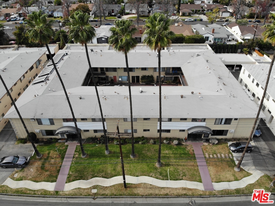 We are pleased to present a twenty-eight (28) unit apartment build- ing located at 5261 Whitsett Avenue in Valley Village, California. The subject property is situated in prime Valley Village location, north of West Magnolia Boulevard and east of Laurel Canyon Boulevard. Built in 1957, this offering contains a good unit mix of twenty-one (21) one-bed- room/one-bathroom units and seven (7) two-bedroom/one-bathroom units. Each unit features spacious living rooms, hardwood floors throughout, large bedrooms with ample closet space, central HVAC, and ceiling fans throughout. The kitchens feature nice cabinetry, granite countertops, dishwashers, microwaves, and gas stoves. The bathrooms feature shower/tub combos with granite tile and a vanity. Select units were recently renovated. This courtyard is incredibly secure with gated entry access and features a community pool with surrounding recreation area. Behind the main front building there are plenty of carports available for the tenants. The front yard is a large grassy area with car parking on either side. This well-maintained property comes with on-site laundry and 33 onsite parking spaces.