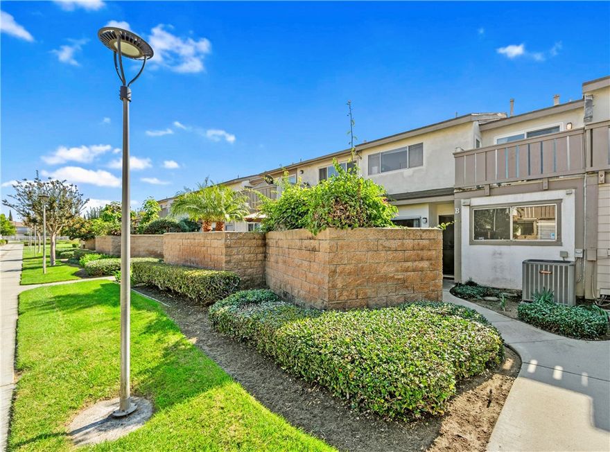 Welcome to 5132 W 1st Street, Unit B – offering comfort, convenience, and potential in the Cambridge Green community of Santa Ana. This spacious 3-bedroom, 2.5-bathroom home has been thoughtfully cared for by its current owner and is ready for the next chapter. Inside, you’ll find a functional floor plan with all bedrooms located upstairs, including a primary suite with a walk-in closet and private balcony—perfect for enjoying your morning coffee or an evening breeze. The main level features an open living area that opens to a private courtyard with a small concrete patio and low-maintenance artificial turf, ideal for relaxing or entertaining. The attached 2-car garage provides direct access to the home and convenient laundry hookups, with the washer and dryer both included in the sale. Recent updates include a newer A/C system installed 2 years ago and water heater installed in 2020. This home offers a wonderful opportunity to customize and create your own modern retreat with a few personal touches. Located in a gated community featuring a pool, spa, and clubhouse, residents also enjoy the benefit of HOA dues covering water and trash service. Don’t miss this chance to own a home with endless potential in the heart of Santa Ana.