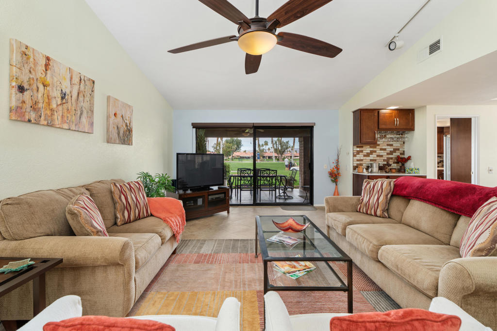 Welcome to your dream retreat! This upgraded 2,051 sq. ft. El Grande model condo offers 3 generous bedrooms and 3 stylish bathrooms, blending comfort with elegance. Soaring ceilings and thoughtfully placed solar tubes fill the home with natural light, creating a bright, open atmosphere.Step out to the tiled patio and take in the serene view of golfers teeing off on a scenic 210-yard par 3. Just a short stroll away, you'll find the sparkling community pool--perfect for sunny afternoons. Inside, a recently updated HVAC system ensures year-round comfort.The kitchen, fully remodeled just 3 years ago, is a chef's delight with modern cabinetry, stainless steel appliances, and a sleek, contemporary design.Enjoy a lifestyle of convenience with the clubhouse just steps away, featuring dining, card games, pickleball, tennis, and a well-equipped fitness center. Chaparral Country Club's prime Palm Desert location puts fine dining, shopping, and entertainment right at your fingertips.From nearly every angle, you'll be captivated by sweeping mountain views--best enjoyed while relaxing on your private patio, listening to the gentle rustle of palm fronds.