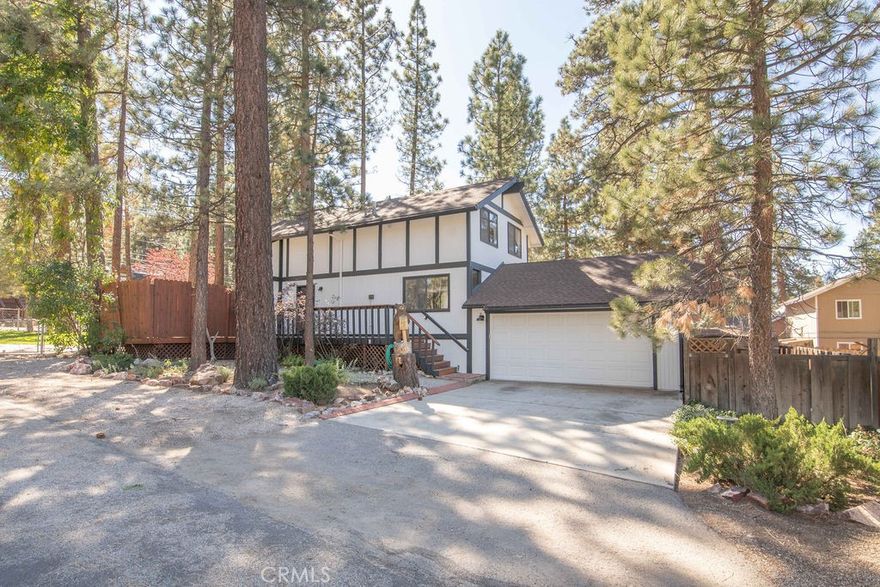 This beautiful Big Bear City home offers the perfect blend of rustic charm and modern convenience and could be just what you’ve been waiting for! Tucked away in a quiet neighborhood and sitting on a beautiful corner lot, you’ll find easy access to Big Bear Blvd and the benefit of being located directly across the street from the Maple Lane Trails where you can enjoy the beauty of the mountains, fresh mountain air, scenic forest views, and year-round outdoor adventures right from your doorstep. This charming 3-bedroom, 2-bath home has been thoughtfully remodeled from top to bottom, featuring new paint, flooring, lighting, an updated kitchen, refreshed bathrooms, and striking beamed ceilings that add warmth and character. The layout offers a cozy wood-burning fireplace, separate dining area, laundry, and a spacious 2-car garage. Tastefully decorated and well appointed with all items negotiable, it’s possible that all you may need to bring is your toothbrush! Whether you are a looking for a primary residence, a second home or an investment property… this checks all of the boxes and is an amazing opportunity that you won’t want to miss!