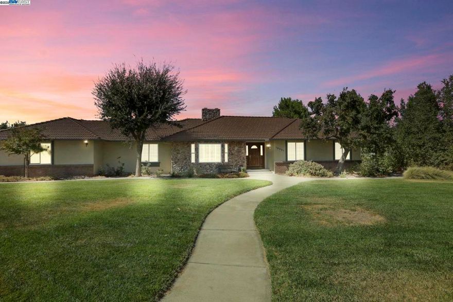 Welcome to Los Ranchos Estates! This beautifully maintained 5-bedroom, 4-bath, 3,346 sq ft ranch-style home sits on a full acre and offers exceptional space, comfort, and versatility. The property includes a 1-bedroom, 1-bath ADU with a full kitchen, porcelain tile flooring, walk-in closet, and a private entrance — perfect for multigenerational living or rental income.  Enjoy cost-saving owned solar, 50-amp EV port, and 3 HVAC systems for year-round efficiency. Inside, you’ll find gorgeous hardwood floors, soaring ceilings, dual-pane Milgard windows, new water softener, and new central vacuum system. The spacious 3-car garage features a durable polyaspartic floor coating, while the newer fencing enhances privacy and security.  Step outside to a vegetable garden, automatic sprinklers, drip irrigation throughout, chicken coop, and wide-open space with room to roam. Located just off Mountain House Pkwy, this home offers quick access to freeways, shopping, and everyday conveniences — yet still feels tucked away in a peaceful, tight-knit neighborhood. Close to Lammersville K-8 and Mountain House High School.  Enjoy holiday parades, horseback riders, and a true sense of community — a rare lifestyle that’s hard to find and easy to fall in love with.