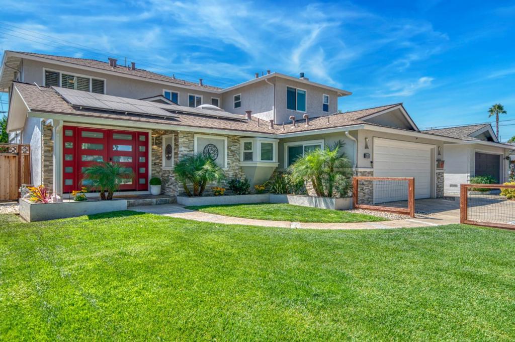 In the heart of Willow Glen this home offers space, style, and sophistication on a generous scale. This six-bedroom, four-bath home blends modern design with everyday comfort. At its core, the open kitchen, dining, and family room serve as the homes natural gathering place. The chefs kitchen is both striking and practical, anchored by a statement eat at island with a gas cooktop, farmhouse sink with touchless or voice-activated faucet. The adjoining living room with its fireplace, wet bar, wine fridge and built-ins invites relaxation or entertaining. The layout balances convenience and privacy with two bedrooms and two full baths on the main level. Upstairs, the primary suite feels like a personal retreat with an impressive walk-in closet and a spa-inspired bath featuring a walk in wet room with freestanding tub and shower. Three additional bedrooms and another full bath provide room for everyone. The backyard is inviting with its built-in kitchen, covered patio and pergola. Additional highlights include hardwood flooring throughout, dual-zone HVAC, smart home integrations, owned solar and a tankless water heater. All of this is set in one of San Joses most desirable neighborhoods, just a short walk to Booksin Elementary and close to downtown WGs vibrant shops and dining.