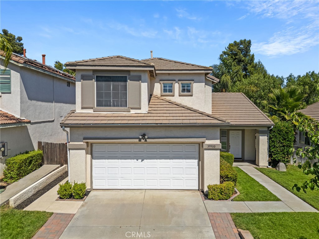 Welcome to a beautifully updated two-story residence nestled in the heart of Murrieta. This delightful home offers the perfect blend of comfort, style, and convenience—paired with very low taxes and a low HOA.
Step inside to a bright and airy living/dining room featuring vaulted ceilings and stunning upgraded flooring that flows throughout the main level. To the left, two large entryways guide you into the recently remodeled kitchen and cozy family room. The kitchen is a chef’s dream with quartz countertops, ample cabinetry, standing range with overhead microwave, and modern finishes throughout. Adjacent to the kitchen, the family room features a welcoming fireplace and a built-in desk.
Down the hall, you'll find a convenient half bath, indoor laundry room, and access to the attached garage.
Upstairs, you'll discover a built-in hallway cabinet, three spacious bedrooms, and two full bathrooms. The primary suite impresses with vaulted ceilings, a media niche, and an en-suite bathroom complete with dual sinks and a walk-in closet.
Don't miss this incredible opportunity to own a move-in ready home in one of Murrieta’s most desirable communities!