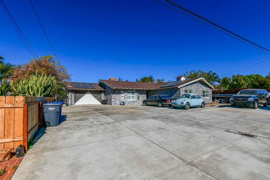 Welcome to 13138 Julian Ave, a fully remodeled home in Lakeside! This spacious 4-bedroom, 2-bath home offers 2,184 sq. ft. of beautifully updated living space on a massive lot. With a brand-new A/C system, stunning new bathrooms, and a sleek, modern kitchen, this home has been meticulously upgraded to provide both comfort and style. Enjoy the luxury of a new fireplace, fresh interior and exterior paint, and a newly replastered pool. The property also boasts new plumbing throughout, a convenient outdoor shower by the pool, and new concrete surrounding the home, offering a fresh, clean look. With solar panels, this home is both eco-friendly and energy-efficient. Don't miss the opportunity to own this stunning property that combines modern upgrades with spacious outdoor living.