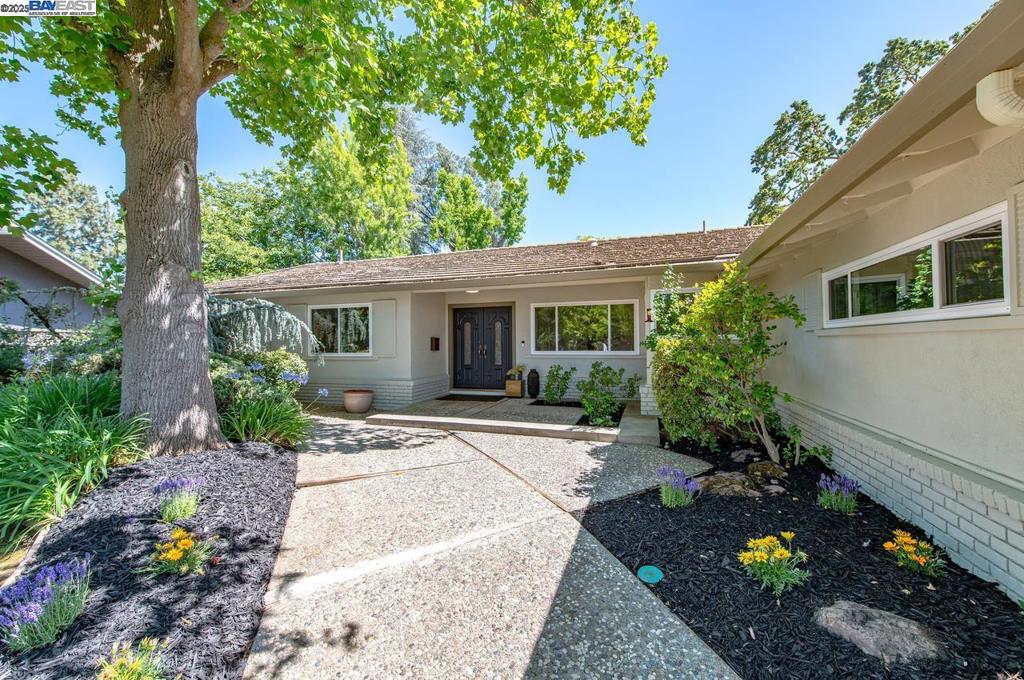 Discover modern elegance in this beautifully remodeled single-story home nestled in the coveted Granada Woods neighborhood of Livermore. Spanning 1,926 square feet, this residence offers an open floor plan that seamlessly integrates style and functionality. Upon entering, you'll be greeted by refinished hardwood floors that lead you to a spacious living area adorned with a cozy fireplace, perfect for intimate gatherings. The updated kitchen is a true culinary haven, boasting new stainless steel appliances, quartz countertops, and a dedicated dining area, ideal for entertaining guests. This exquisite home features three generously sized bedrooms and two and a half tastefully updated bathrooms, each showcasing quartz countertops and new vanities, ensuring a luxurious experience. Essential amenities such as updated HVAC system, laundry with a washer and dryer are included for your convenience. Stepping outside, the private & lush backyard is a sanctuary of tranquility with a patio and lush landscaping, offering an idyllic setting for relaxation or outdoor dining. The expansive 10,775 square foot lot also includes ample parking space. Positioned close to shopping and downtown Livermore, this home combines comfort and convenience in a serene setting.