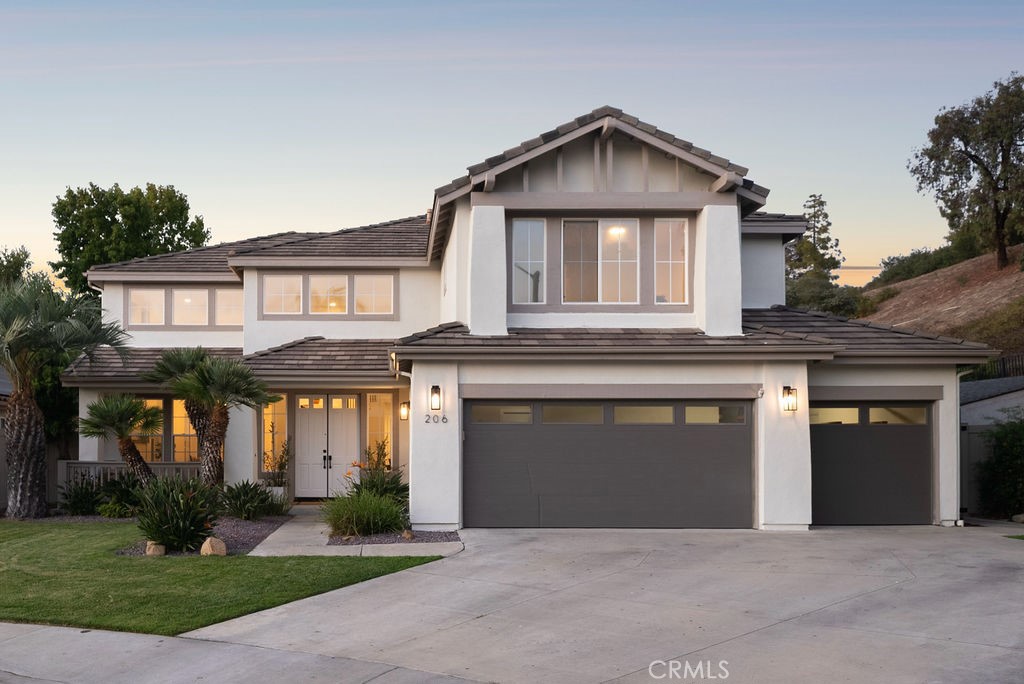 Tucked at the end of a quiet cul-de-sac in San Clemente, 206 Gurrego presents a fully reimagined modern beach home that blends refined design with everyday livability. Backing to the natural hillside, the property offers rare privacy and a serene setting, while still placing you minutes from the coast. Inside, the home has been completely remodeled with a sleek modern aesthetic, defined by clean lines, open living spaces, and abundant natural light. Expansive windows frame views of the sunlit backyard, creating a seamless connection between indoors and out. The backyard itself is a standout—an oversized lawn bordered by the hillside provides both space and seclusion, perfect for gatherings, play, or quiet relaxation. A three-car garage adds to the home’s functionality, offering ample storage for beach gear, bikes, or a golf cart to fully embrace the San Clemente lifestyle. This rare offering combines modern design, privacy, and a premier coastal location, delivering a home as stylish as it is practical.