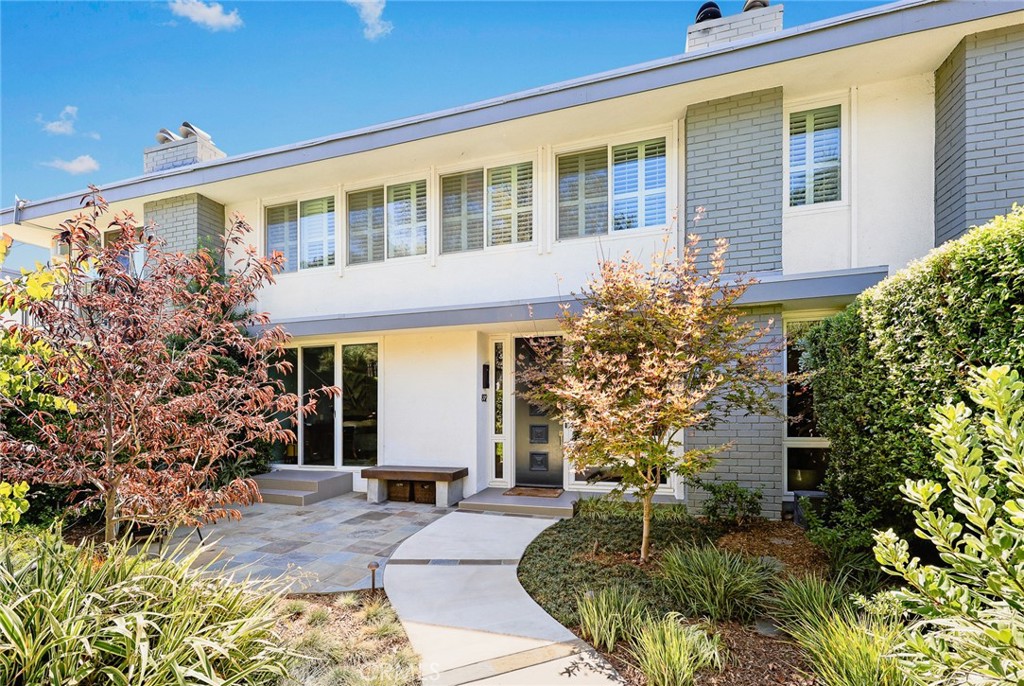 Welcome home to a sophisticated and fully renovated single-story condo located just off Pasadena’s famed Millionaire’s Row. Offering abundant natural light and 1,546sf of thoughtfully designed living space, this home is a short distance from Old Pasadena’s shopping, dining, and entertainment, as well as the Arroyo Seco trails and Norton Simon Museum. A private, professionally landscaped garden oasis with fountain sets the tone for this residence. Inside, oversized windows brighten the living, and custom window treatments and high-end lighting complement the dining, two bedrooms and den. A gas fireplace adds warmth and ambiance to the open living area, designed for both comfort and entertaining. The renovated kitchen features updated finishes, abundant cabinetry, and new appliances, and the two beautiful bathrooms make the home completely move-in ready. The spacious primary suite overlooks the tranquil garden and includes a wall of closets. The second bedroom and a versatile den face the patio, with windows that provide natural light and a sense of openness. Additional conveniences include in-unit laundry, two dedicated parking spaces, and an extra-large 10' x 14' private storage room in the gated subterranean garage with elevator access. The well-maintained community offers manicured grounds and a heated sparkling pool, with HOA dues covering gas, water, trash, and exterior maintenance. Blending recent updates, a private garden setting, and an unmatched Pasadena location, this home delivers low-maintenance living with timeless sophistication. Don’t miss the opportunity to experience the best of Pasadena living in this move-in-ready gem.
