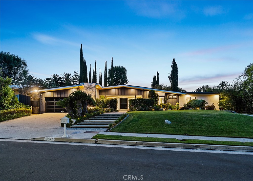 Completely re-imagined mid-century single story luxurious oasis nestled within a coveted S. of the Blvd Tarzana neighborhood. Designed with impeccable attention to detail and luxurious finishes throughout. Spacious family room with a dual sided fireplace and vaulted beamed ceilings create a warm atmosphere. Open concept floor plan bursting with natural light throughout the home. Elegant chefs kitchen displaying top tier Thermador appliances, custom cabinetry and large center island with nook seating. Oversized master suite with massive walk in closet space and indulging bathroom with soaking tub, double vanity and walk-in shower. Expansive backyard is an entertainer's paradise featuring, sparkling pool and full sport court, covered patio and generous grassy area all surrounded by lush landscaping . Idyllic location near parks, trails and country/golf clubs such as Braemar and El Caballero. Just minutes from the Valley's best shopping, restaurants and entertainment, this one has it all!
———————————
HOME IS ALSO AVAILABLE FULLY FURNISHED AT AN ADDITIONAL FEE