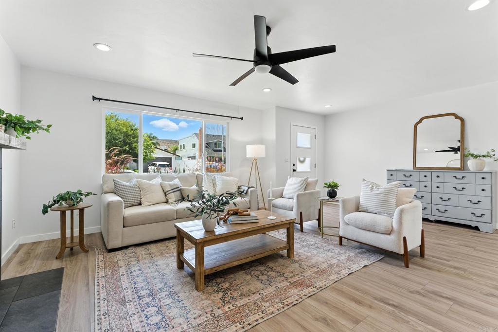Welcome to your dream home—fully remodeled, turn key and thoughtfully upgraded throughout! This stylish single-story stunner is nestled in a sought after Santee neighborhood with wide, welcoming streets and a true sense of community. Step inside to find abundant natural light, sleek vinyl flooring throughout, smart thermostat and modern aesthetic. The spacious living area centers around a gas fireplace, creating the perfect atmosphere for relaxing or entertaining. The fully loaded kitchen features stainless steel appliances, crisp finishes, and seamless flow into the dining and living spaces. Outside, enjoy your own private oasis with a sparkling pool and spa, new fencing, and newer turf in the backyard—perfect for year-round enjoyment. Thoughtfully installed solar lights, sun shades in both front and back, and new, water-conscious hardscaping make the space as functional as it is beautiful. Plus, there’s dedicated RV parking for all your adventures and toys. Air conditioning and dual pane windows work great for year-round comfort. Conveniently located near top-rated schools, Mission Trails Regional Park, and Santee Lakes Recreation Reserve.