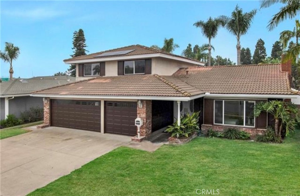 Absolutely Stunning, Completely Remodeled 4 Bedroom, 3 Bath Pool Home with 2 Primary Suites - 1 Up and 1 Down. This Contemporary Masterpiece Boasts Brand New Luxurious Bathrooms, a Brand New Chef's Dream Kitchen, a Sunlit Arizona Room with Cathedral Ceiling, a 3 Car Garage, and an Inside Laundry Room. Located in one of Fountain Valley's Premier Neighborhoods, Steps to Park and Close to All Award-Winning Schools, this Gorgeous Home Feels Like a Brand New Home, Beautifully Appointed with Central A/C, Whole House Fam, Dual Pane Windows, Wood Vinyl and Designer Tile Flooring, Extensive LED Recessed Lighting, Exquisite Light Fixtures, a Plethora of Accent Lighting, High Baseboards, New Paint, Smooth Ceilings, Raised Panel Interior Doors, Hand-Crafted Wood Staircase, Quartz Countertops, Ceiling Fans, and More! It has Lovely Curb Appeal with Professional Landscaping, Brick Siding, a Covered Front Porch, and Double Door Entry with Beveled Glass. Step Inside to the Amazing Modern Chic Living Room with Wall of Marble-Type PVC, Wall-Mounted Electric Fireplace, Sconce Lighting, and Lighted Open & Floating Shelving. Adjacent Formal Dining Room is Open to the Brand New Gourmet Kitchen that Includes: Professional-Grade THOR Stainless Appliances (6-Burner Range w/Pot-Filler, Hood/Vent, Dishwasher, Under-Counter Microwave, Refrigerator), Quartz Counters, Backsplash, and Waterfall off the Peninsula with Bar Seating, White Shaker Self-Closing Cabinetry w/Lighted Glass Display Panels & Under-Counter Lighting. The Kitchen is Also Open to an Inviting Family Room w/Wet Bar, Built-in Wine cooler, and Sliders that Open to the Lovely Enclosed Patio that Overlooks Extra Large Backyard with Sparkling Pool, Spa, Tropical Landscaping, and Huge Deck Area that's Perfect for Wonderful Outdoor Entertaining and Relaxation. All 3 Bathrooms are Breathtaking with Brand New Fixtures, LED Touch-Light-Up Mirrors, New Vanities, Linen-Textured Tile Flooring, Walk-In Showers w/Clear Glass Enclosure, Multiple Shower Heads & Lighted Shampoo Niches, Plus Floor-to-Ceiling Marble-Type Walls & Surrounds. This Exquisite Home is Ready for Move-In.