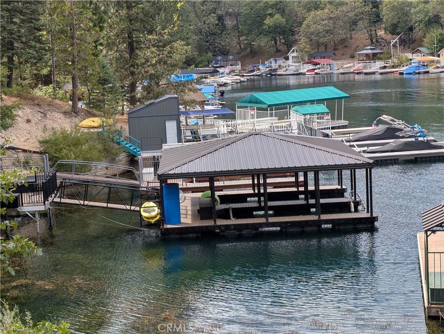 Don't Miss this Newer, Exquisite Half-Double Dock in Emerald Bay! Nestled in the sheltered southeast corner of exclusive Emerald Bay, this newer 1/2 double aluminum dock with a durable metal roof offers a premium lakefront lifestyle. Positioned in deep, calm water, it provides ideal conditions for boating, swimming, and lakeside relaxation. The spacious entertaining area is just a short walk to ALA-maintained restrooms, and a dock box is included for convenient storage. Easy accessible beach nearby the side of the dock is idyllic for swimming or relaxing. A rare opportunity to own a beautifully appointed dock in one of Lake Arrowhead’s most protected and desirable bays! Don't miss this fantastic dock!