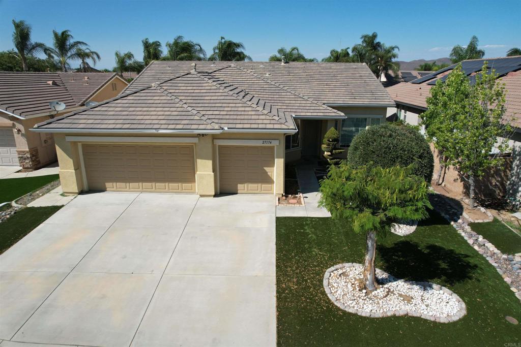 Fall in love with this beautiful single-story home in one of Menifee’s most sought-after neighborhoods! With 3 bedrooms, a den, and 2 baths spread across 2,304 sq. ft., there’s room for everyone. The 3-car garage gives you space for cars, toys, or a workshop. The curb appeal is inviting with fresh artificial turf, while the low-maintenance backyard is ready for summer BBQs under the alumawood-covered patio. Inside, you’ll find a spacious layout, designer touches, and plenty of potential to add your own style. A few cosmetic updates will make this home truly yours — perfect for buyers ready to create instant equity and step confidently into homeownership. Low taxes, a small HOA, and close proximity to shopping, schools, and entertainment make this the one you’ve been waiting for!