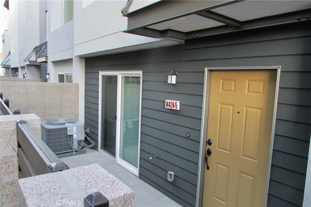 Welcome to this modern and beautifully updated townhome located in a gated community offering the best of South Bay living. The main level features an open-concept layout with vinyl plank flooring throughout that seamlessly connects the living, dining and kitchen areas. The remodeled kitchen includes stainless steel appliances, white cabinetry and a convenient eat-in bar perfect for entertaining. Upstairs, the spacious primary suite offers a large walk-in closet and a luxurious bathroom with a soaking tub, glass-enclosed shower and dual vanities. A second bedroom, full bathroom and in-unit laundry area with washer and dryer complete the upper level. Downstairs, you'll find a third bedroom with its own full bathroom and a private enclosed patio ideal as a guest room or home office. Built in 2018, this home also features central AC, a direct access two-car garage and a charming front patio to enjoy warm summer evenings. Centrally located near major freeways with easy access to restaurants, Target, Sam’s Club and the Rosecrans Recreation Center, this townhome offers comfort, style and convenience in one exceptional package.