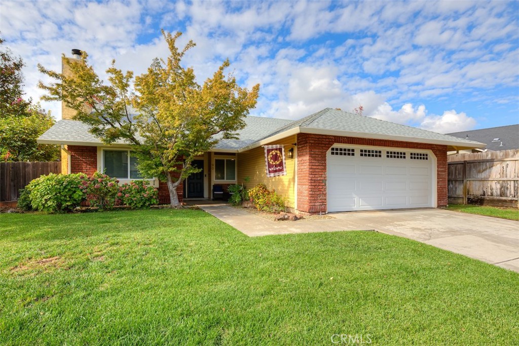 Welcome to the picturesque California Park neighborhood, where scenic lakes, peaceful hiking trails, Blue Oak Park, and the beautiful Canyon Oaks Golf Course are just steps away. Nestled on a spacious corner lot, this well-maintained 4-bedroom, 2-bath home offers approximately 1,750 square feet of comfortable living space with owned solar for energy savings. Inside, a well-designed layout features a spacious living area with a charming brick fireplace and a welcoming dining room, creating an inviting setting for both everyday living and entertaining. The kitchen is a true highlight, offering ample storage and counter space, stainless steel appliances, a functional island, and a window-lined eat-in area that fills the space with natural light. The primary suite is generously sized and includes two closets—one of which is a walk-in—for added storage. The ensuite bathroom features a dual-sink vanity with recessed lighting and a tub-shower combo. From here, enjoy direct access to the private backyard, where a covered awning, lush green lawn, dog run, and fruit trees create a peaceful and versatile outdoor retreat. Three additional bedrooms provide plenty of space for family, guests, or a home office. A separate laundry room and wide hallway add extra functionality and ease to daily living. Thoughtful updates throughout the home include a 2.5-year-old roof, newer HVAC system (installed in 2020), fresh interior paint, new flooring, updated windows and sliding doors, a new insulated garage door, new toilets, and modern ceiling fans—enhancing overall comfort, efficiency, and style. This beautiful home is ready to welcome its next owner. Don’t miss your chance—call today to schedule your private showing and experience all it has to offer!