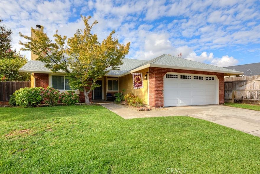 Welcome to the picturesque California Park neighborhood, where scenic lakes, peaceful hiking trails, Blue Oak Park, and the beautiful Canyon Oaks Golf Course are just steps away. Nestled on a spacious corner lot, this well-maintained 4-bedroom, 2-bath home offers approximately 1,750 square feet of comfortable living space with owned solar for energy savings. Inside, a well-designed layout features a spacious living area with a charming brick fireplace and a welcoming dining room, creating an inviting setting for both everyday living and entertaining. The kitchen is a true highlight, offering ample storage and counter space, stainless steel appliances, a functional island, and a window-lined eat-in area that fills the space with natural light. The primary suite is generously sized and includes two closets—one of which is a walk-in—for added storage. The ensuite bathroom features a dual-sink vanity with recessed lighting and a tub-shower combo. From here, enjoy direct access to the private backyard, where a covered awning, lush green lawn, dog run, and fruit trees create a peaceful and versatile outdoor retreat. Three additional bedrooms provide plenty of space for family, guests, or a home office. A separate laundry room and wide hallway add extra functionality and ease to daily living. Thoughtful updates throughout the home include a 2.5-year-old roof, newer HVAC system (installed in 2020), fresh interior paint, new flooring, updated windows and sliding doors, a new insulated garage door, new toilets, and modern ceiling fans—enhancing overall comfort, efficiency, and style. This beautiful home is ready to welcome its next owner. Don’t miss your chance—call today to schedule your private showing and experience all it has to offer!