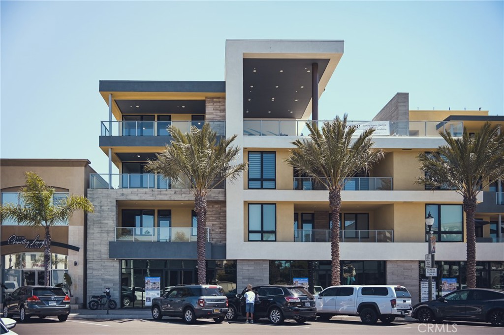 Introducing a landmark in Downtown Huntington Beach's skyline, the premier new construction development of the area. This resort-style haven offers a lifestyle of luxury and convenience, boasting amenities tailored for the discerning resident.
Step into a world of modern living, where expansive windows fill the space with natural light and frame stunning views of Main Street, the iconic pier, and the sweeping San Bernardino Mountains and Saddleback range. This exceptional building offers thoughtful, exclusive amenities—including private electric car charging stations—bringing eco-friendly convenience to every resident.
Designed for the active beachgoer, this property provides private surfboard and beach storage lockers, along with bike storage for exploring the vibrant neighborhood. Experience the epitome of outdoor living at the 4th level rooftop terrace, complete with multiple BBQs and fire pits, perfect for entertaining against a backdrop of the Main Street Promenade and ocean vistas.
Inside, discover unparalleled sophistication with Bertazzoni appliances, quartz countertops, and counter-to-ceiling backsplash in the primary bathrooms, accentuated by vanity sconces for added elegance. Enjoy the airy ambiance created by close-to-10' ceilings as you relax in either of the ensuite bedrooms, with each primary bath featuring a frameless glass shower and a generously sized walk-in closet.
Additional highlights include a guest powder room for added convenience, a spacious indoor laundry room for effortless chores, and a separate bonus room adjacent to the expansive open great room, providing versatility for your lifestyle needs.
Indulge in Southern California living at its finest with a large private deck offering sun-drenched exposure, perfect for basking in the coastal breeze or hosting intimate gatherings. Don't miss your chance to experience luxury living at the heart of Huntington Beach's vibrant community.