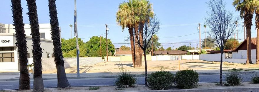 As you pull up to the property you will say WOW!  Located in the sought-after heart of Indio, directly across the street from the newer College of the Desert Campus, a quick walk to the Riverside County Courthouse and plus, the famous Indio Fairgrounds.  Lots of new construction and redevelopment. This land is fairly level, approximately 150' wide, 100' deep, street parking in the front, alley access in the back, and the 3 palm trees are included.