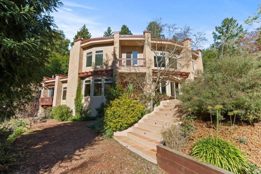 Modern tranquil villa retreat property in Los Gatos Hills!  Multi-family possibilities with 5 generously sized bedrooms, 3.5 luxurious bathrooms. Separate lower level 1 bed/1 ba for in-law, wine room or hang out. 1 finished adu and  plus potential 2nd adu Stunning estate a offers a harmonious blend of elegance and functionality. The heart of this home is a breezy floor plan with stunning tall wood beam ceilings, oak floors and generous windows and french doors. Gorgeous chefs kitchen, boasting a built-in refrigerator, a gas stovetop with a professional hood, double ovens, and exposed wood beams. Enjoy meals at the breakfast bar or in the formal dining room. The family room, with its inviting fireplace and wall of windows, seamlessly connects to the living room adorned with a wood-burning stove and french doors leading to the outdoor living area. Step outside to discover a private oasis entertainment area with bbq, fire pit and hot tub. Lovely sunning patio areas surround. Upper property has 540 sf  guest house with barn. Lower property has raised bed gardens, apple, peach, apricot, lemon, fig, plum, orange trees and trail to redwood forest with fairy ring, bbq/party area.  Great commute central summit location, Loma Prieta/CT English & Los Gatos High. Your paradise awaits!