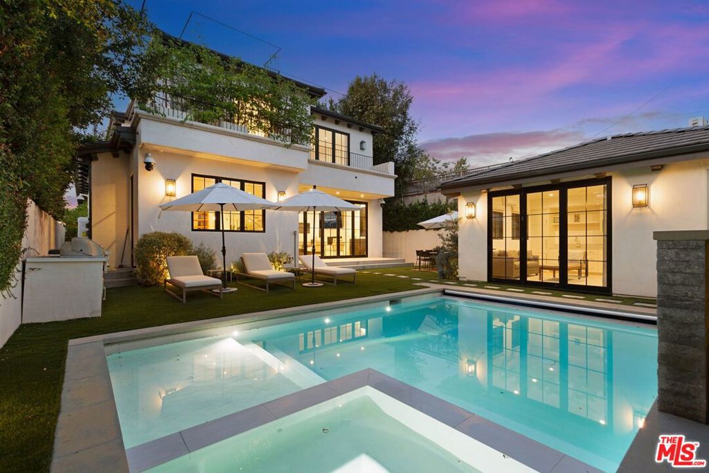 Welcome to 6360 Drexel Ave, a blend of contemporary design and timeless elegance in a prime Los Angeles neighborhood. This spacious 5 bedroom, 6 bathroom home features an open floor plan perfect for entertaining with its seamless indoor outdoor flow. The ADU with a full kitchen and bathroom is perfect as a separate bedroom or office. The gourmet kitchen includes high-end stainless steel appliances, a quartz island, custom cabinetry, and a walk-in pantry. The luxurious primary suite offers a walk-in closet and a spa-like bathroom with dual vanities, a soaking tub, and a walk-in shower. The landscaped backyard is an entertainer's dream with a pool, built-in barbecue, and ample space for dining and lounging. Enjoy breathtaking views of Los Angeles from the rooftop deck. This home also includes an EV charger. In close proximity to the best of LA dining, shopping, and entertainment while relishing your private retreat.