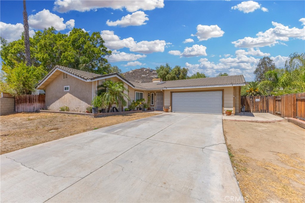 Absolutely Gorgeous!! This incredible single-story ranch style view home sits at the end of an amazing cul-de-sac. It is nestled in the beautiful and highly coveted Sierra Heights Community in Riverside which provides relaxed style living and beautiful aesthetics. Situated on over 13,000 sq ft and showcasing spectacular views, spaciousness, and privacy, you will absolutely love the uniqueness this lot and location have to offer. The home is positioned off the street at the end of a cul-de-sac and has an amazing front yard, pull through garage, breathe taking backyard, and a large 2 car garage. The stunning backyard is huge, serene, and an entertainer's delight. It has room for a pool and spa, kids & pets to play, and parents to entertain and BBQ! The home is equally amazing and meticulously cared for. Pride of ownership permeates this house as it boasts many upgrades and amenities such as bright and open floor plan, tile and laminate flooring, baseboards, tall ceilings, ceiling fans, recessed lighting, huge kitchen with a lot of cabinets, granite countertops and granite backsplash, stainless steel appliances, large pantry, tile cased fireplace, big primary bedroom with closet, large bedrooms, and so much more. A little TLC and customization and this can be your dream home! Words and pictures can never convey the beauty and potential this home and neighborhood have to offer, come and see for yourself!!