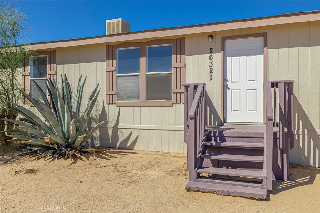This single story manufactured home located at the gateway to the Sierra Mountains has been completely repainted exterior, interior, all new flooring, a very private separated floor plan with primary bedroom and bathroom on one wing. The Kitchen has white painted cabinets with brush nickel pulls, white appliance. There's an indoor laundry room, vaulted ceilings, recessed lighting, separate detached two-car garage. There are nice patio decks on the front and the rear of the home. Views of the mountains. Easy access to Freeway 14 Hwy 59 & Hwy 395 near Mojave Airport and Edwards Air Force Base