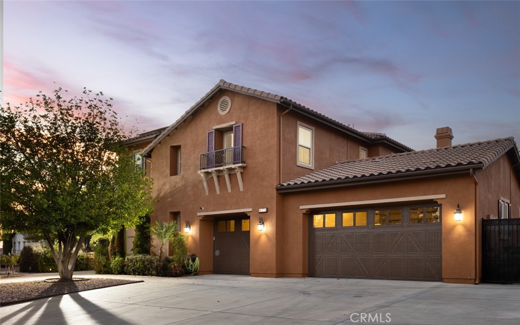 Welcome to 16778 Nandina Avenue, an exceptional two-story estate in the prestigious Alicante Estates of Mockingbird Canyon! Built in 2006, this impressive residence offers approx 5,426sq.ft. of living space with 5 bedrooms and 5.5 bathrooms, set on a flat, nearly ONE ACRE lot with breathtaking mountain views. Designed with both elegance and functionality, the home features a highly desirable MAIN FLOOR bedroom with en-suite bath and a rare 5-CAR GARAGE (3-car attached, including a drive-through, plus a 2-car detached garage). Inside, soaring ceilings, abundant natural light, and an open layout create a warm and inviting atmosphere. The gourmet kitchen is a chef’s dream, complete with a butler’s pantry, extensive cabinetry and counter space, spacious center island with a dedicated prep sink, and premium finishes. Upstairs, the luxurious primary suite showcases custom built-ins, a private sitting area with dual-sided fireplace, expansive walk-in closet, and a spa-like en-suite bath. Each secondary bedroom is generously sized with its own bathroom, ensuring comfort and privacy for all. Ideal for everyday living and entertaining, the versatile floor plan features a formal living room, separate family room, elegant dining room, theater/game room, wine storage with a custom iron door, and a downstairs flex space—perfect for an office with French doors. Step outside to a resort-style backyard featuring a sparkling pool and spa, expansive covered patio with outdoor TV, surround sound and fans, a built-in BBQ, outdoor fireplace, gated RV parking with electrical hookups, and even a regulation-sized sand volleyball court! The grounds are beautifully enhanced with custom hardscaping and a variety of fruit and citrus trees—including orange, lemon, blood orange, tangerine, apple, pear, pomegranate, and plum. Modern upgrades such as OWNED SOLAR panels ensure energy efficiency and year-round comfort. For car enthusiasts, the rare drive-through garage and additional detached garage provide abundant space for vehicles, storage, and more. A perfect blend of style, comfort and modern amenities, this exceptional home invites you to experience Riverside living at its finest.
