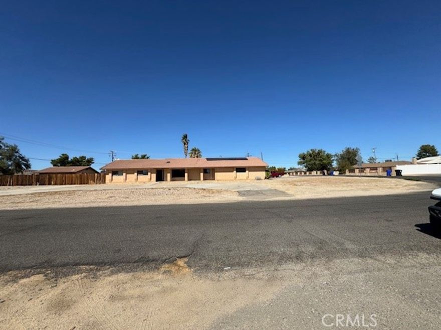 Welcome to 18080 Manitou Rd in the heart of Desert Knolls! This custom-built single-level home sits on a beautiful 0.92-acre corner lot and offers so much to love. Inside, you’ll find 3 spacious bedrooms, 2 full baths, and one half bath across 1,980 sq. ft., plus a 576 sq. ft. guest house with its own half bath, tile flooring, and sliding glass doors—perfect for guests, extended family, art room, or a private office.  The main home features a large living room with a cozy wood-burning corner fireplace, an open kitchen with a generous utility/laundry room, and a primary suite with direct access to the back yard through a sliding door.  Outdoors, the property shines with horse zoning and cross-fencing, a circular driveway, an attached 2-car garage with a side driveway, a covered RV carport with hookups, multiple RV gates, and two storage sheds. Enjoy evenings under the spacious covered patio or take advantage of the nearby Mojave Narrows Park—for horseback riding and outdoor fun. Other features include solar panels, stucco exterior, and a prime Desert Knolls location close to Highway 18, schools, shopping, and commuter routes.  This unique property truly has something for everyone—space, comfort, and endless potential to make it your own! Call today to schedule a tour!!!