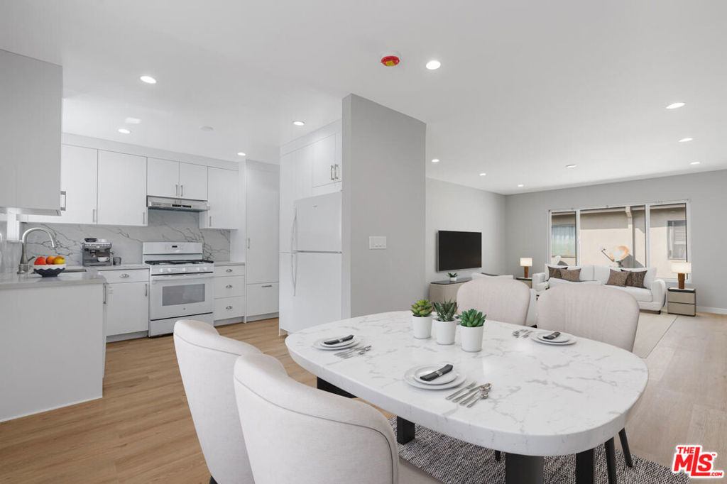 Welcome to 4023 Lincoln Avenue #4 a thoughtfully updated 2-bedroom, 1-bath residence offering modern comfort and convenience in the heart of Culver City. Spanning approximately 1,065 square feet, this bright and spacious upper unit features brand-new upgrades throughout, including cushioned 22-mil LVP flooring throughout, kitchen with a 20 cu. ft. Whirlpool refrigerator plumbed for a water-line, well-designed cabinetry with two drawered pantries, quartz counters and backsplash, ultra-quiet vented under-cabinet hood, large single stainless steel sink, slimline garbage disposal, touchless Delta kitchen faucet, and GE 52 dBa dishwasher with Steam + Sani and Dry Boost; bathroom hardware & fixtures, drawered bathroom vanity cabinet with quartz countertop and whisper-quiet bathroom fan & heater; in-unit LG ultra-large capacity, wifi enabled, washer and dryer with Turbo wash & steam; smart Rinnai water heater that learns your schedule; ceiling insulation for better energy efficiency; and new blinds to be installed before move-in. This unit also includes large closets and storage cabinets in the bedrooms and hallway. This residence also offers optional covered parking and easy access to the best of Culver City - living in the heart of downtown, walking distance to the hottest restaurants, the Culver Steps, Baldwin HIlls Scenic Overlook and the Culver Stairs, Sony Pictures Studios, The Culver Hotel, and the weekly Farmers Market. You are also moments away from The Platform, Helms Bakery and Arts Districts, top-rated schools, and major commuter routes. This home perfectly blends modern living with an unbeatable location (walkscore is 96 out of 100).