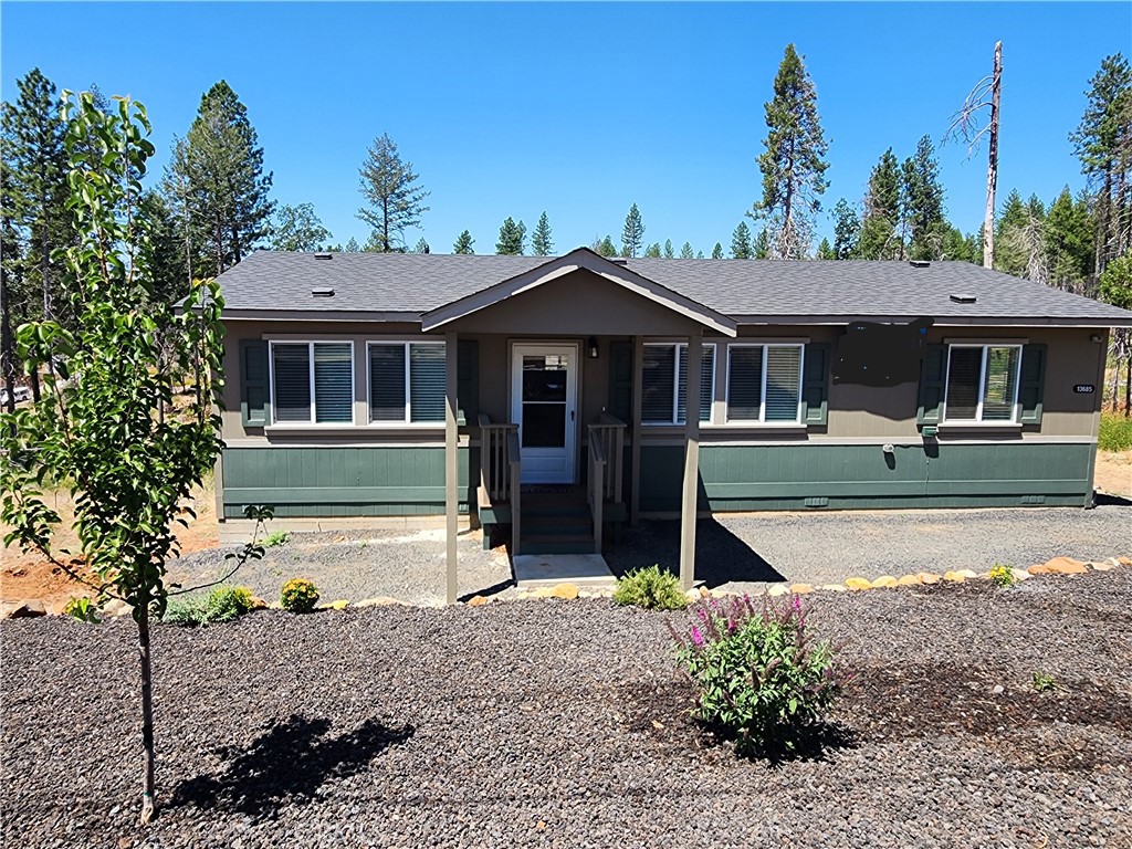 Welcome to 13685 W. Park Drive — a brand-new, thoughtfully designed 2-bedroom, 2-bath home in the peaceful pines of Magalia, complete with a versatile den perfect for a home office, guest space, or hobby room. This modern, energy-efficient home features soft-close cabinetry, a large kitchen island ideal for hosting and everyday living, and a spacious primary suite with a walk-in closet and full-length walk-in shower. Step out onto the back deck and take in the serenity of the greenbelt that borders the property — a quiet space where you can often catch deer and wild turkeys passing through. The covered front porch offers a second outdoor spot to relax and enjoy the mountain air. Located in a POA community with access to amenities like a pool, spa, pickleball courts, hiking trails, and more, this home combines the feel of a forest retreat with the convenience of being just minutes from shopping, dining, and parks. Whether you're downsizing, investing, or planting new roots, this one is ready to go.
