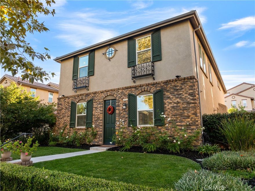 Welcome to your dream home in the highly sought-after West Creek community! This luxurious 4-bedroom, 3.5-bath home offers 2,887 sq. ft. of beautifully designed living space where not a single detail was spared. The open-concept layout features a spacious family room with a marble-faced linear fireplace, a gourmet kitchen with granite countertops, custom backsplash, an oversized island, plus a formal living room and dining area filled with natural light. Downstairs includes a full bedroom and bathroom—perfect for guests—while upstairs offers a large bonus area/loft, three additional bedrooms, and two full bathrooms with dual vanities. The elegant primary suite includes wood ceiling accents, a custom barn door, dual walk-in closets, a soaking tub, walk-in shower, and dual vanities. Additional highlights include modern tile flooring, plantation shutters, crown molding, stainless steel appliances, custom lighting, a tankless water heater, and a paid-for solar system. The laundry area is over sized and includes additional storage area. The exterior is picture-perfect, with meticulously maintained landscaping and excellent curb appeal. The backyard creates a relaxing retreat with a covered patio, recessed lighting, ceiling fan, pavers, and even a lime tree—ideal for morning coffee or evening wine under the stars. 3 total parking spaces, 2 garage and one uncovered next to the garage with an EV charger. Located near top-rated schools, parks, pools, and shopping, this stunning home truly exudes pride of ownership.
