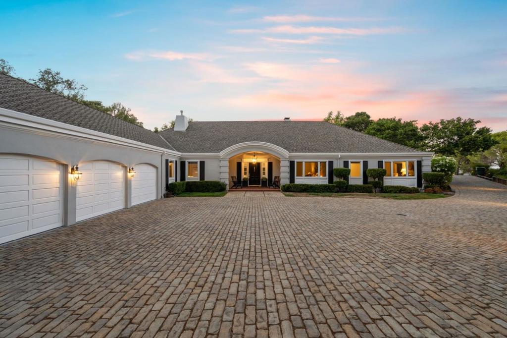 A stunning bucolic estate within the exclusive Hillsborough hills perches at the end of a long, private cobblestone drive. This well-appointed home offers 4,240 sq ft of living space on 2.24 acres with views from virtually every room. Backyards large entertaining patio includes a pool/spa, BBQ area and lifesize Kung Fu Panda statue. Kitchens picture windows let natural light gleam off long granite counters and Viking stove. Sizable vaulted family room adjoins for casual dining. A door off the kitchen leads to dining and living rooms, both with coffered ceilings and wainscotting. Primary Suite impresses with marble-appointed bath, while 2 guest beds have ample closets and share a marbled hall bath that offers much space. Lower level offers a spacious media room, home gym and ensuite bedroom. Mud room off the 3-car garage offers laundry, storage and full bath with sauna. Tremendous grounds and ideal floor-plan in a prized neighborhood make this Hillsborough property a must-see.