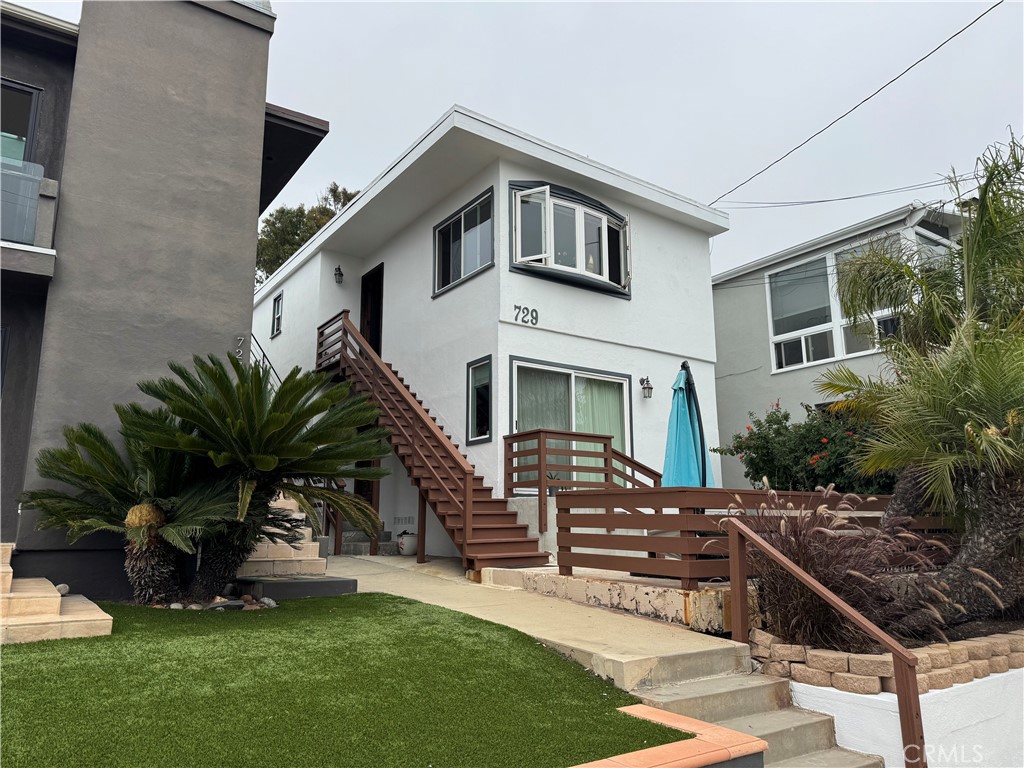 Fantastic income-producing duplex in Hermosa Beach’s prestigious Hill Section! this property offers two 2-bedroom, 2-bath units with separate entrances, providing exceptional flexibility for investors, owner-occupants, or multi-generational living. With a total of approx. 2000 sqft on a 2,505 sqft lot, both units deliver comfortable coastal living in one of the most sought-after neighborhoods. The lower unit features a large ocean-view walk-out patio perfect for entertaining or relaxing, along with hardwood floors, granite countertops, stainless steel appliances, updated finishes, and abundant natural light. The upper unit mirrors the 2-bed, 2-bath layout and includes access to a spacious rooftop deck offering 360-degree ocean views—ideal for enjoying stunning sunsets and coastal breezes. On-site parking and mature landscaping add convenience and curb appeal. Just six blocks to the sand and surf, and within walking distance of vibrant downtown Hermosa Beach and Manhattan Beach restaurants, parks, and shops. This rare duplex opportunity combines beach-town lifestyle, strong rental potential, and prime location. Don’t miss your chance to own an exceptional property in Hermosa Beach’s coveted Hill Section!