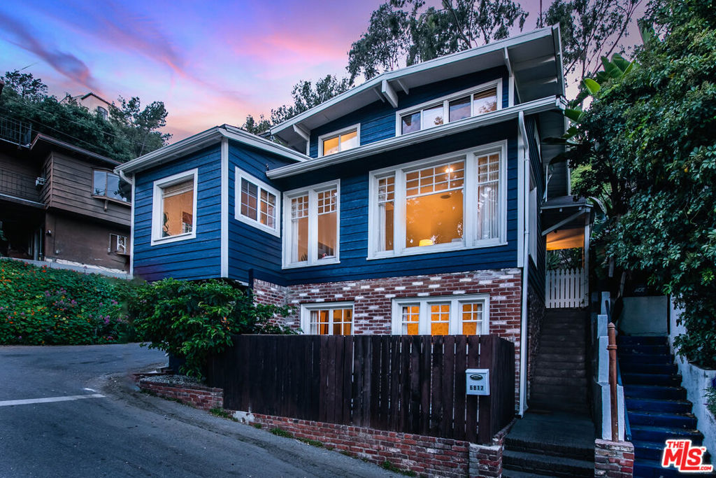 Welcome to your own piece of Hollywood history. Originally a hunting lodge in the 1920s, this Craftsman tri-level has been updated with care to maintain the original character while making it ideal for 2025 living. Whether working from home, leasing the separate first floor, or soaking in the daily calm of this Hollywood Hills retreat as an escape from the city, 6817 TreasureTrail offers all. Light-filled and airy, the home features 2 Bedrooms, 3 Baths, and 2 offices.Renovated kitchen includes top-of-the-line appliances and custom oak cabinetry. Refinished terra cotta floors throughout and primary bedroom boasts view of the Hollywood sign. Beautiful patio and lush garden are perfect for entertaining under the stars. Additional recent upgrades include exterior fire resistant siding, new electrical and tankless water heater, subterranean drainage system, mini splits for seamless heat and AC throughout, and outdoor landscaping irrigation system. Property has easy parking with a detached garage. Close to Universal,Warner Bros, Runyon Canyon and the Hollywood Bowl. Don't miss this rare opportunity.