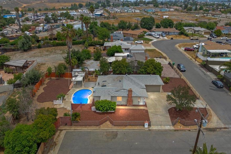 Stunning Fully Remodeled Pool Home on a Corner Lot! Beautifully upgraded 3-bedroom optional 4th bedroom, 2-bathroom pool home on a spacious corner lot in Riverside. Offering 1,206 sq ft of thoughtfully updated living space, this home has been completely transformed and is ready for you to move in and enjoy. Pride of ownership shines throughout, starting with all-new upgrades: plumbing, electrical wiring, central air conditioning, septic system, cabinets, flooring, and fresh paint inside. Every inch of this home has been carefully renovated to offer modern comfort and style. Step inside to a bright and airy living room, filled with natural light and views of the private backyard. The fully remodeled kitchen features sleek finishes and includes new appliances. All three bedrooms are generously sized, with ceiling fans, recessed lighting, and fresh paint creating a calm and welcoming atmosphere. The central HVAC system keeps the home comfortable year-round. Outside, the large backyard is a true retreat, offering plenty of room for relaxing, entertaining, or even expanding your outdoor living space. The sparkling pool is the perfect centerpiece for summer fun. Located on a quiet street, this home has space for RV parking, oversized driveway, and is just minutes from freeway access, local parks, and dining options. You will not want to miss this rare opportunity to own a fully remodeled pool home in a great Riverside neighborhood, schedule your private showing today!
