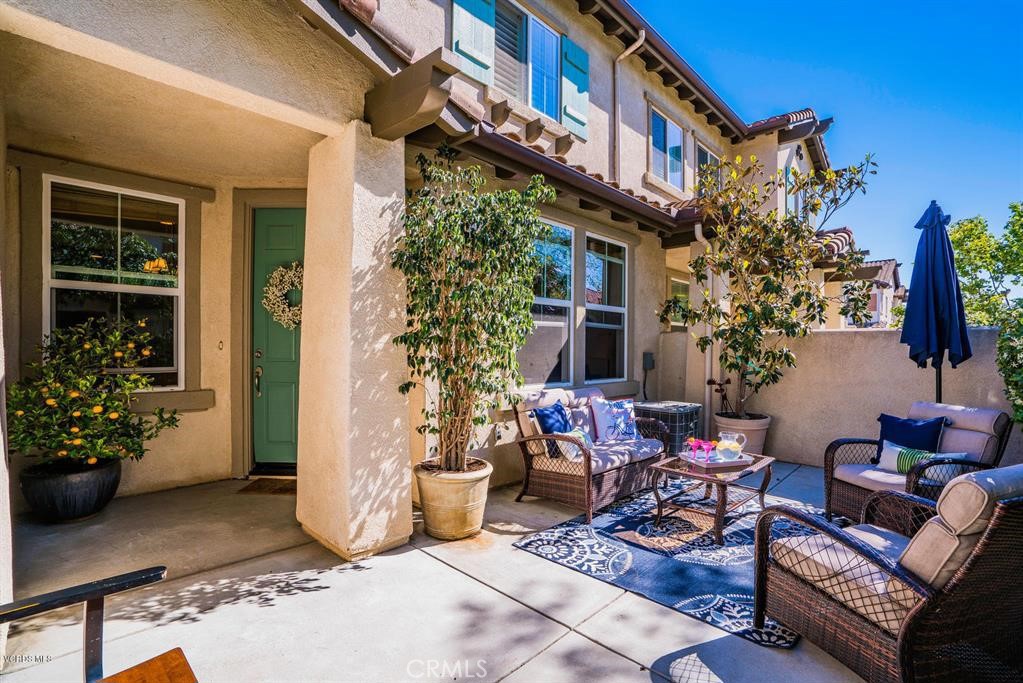 Beautiful townhome in Dos Vientos' Aldea Dos Vientos plan. 2 bedroom, 2 1/2 bath. It is close to Sycamore Canyon Elementary School and Middle School, the community park and community shopping center and hiking trails. After a long day, simply pull in to your two-car garage and easily unload your groceries with direct access to your gourmet kitchen located on the entry level. Once in, you will find beautiful laminate floor throughout lower level living and kitchen areas and newer carpet in upper level areas. The gorgeous kitchen with granite countertop, stainless steel appliances, a large breakfast bar and plenty cabinet / storage spaces will sure be a fun place enjoy home cooking. The master suite features a nice size bedroom and a bathroom with shower / tub, double sink and a separate, private toilet room. The guest bedrooms is of decent size. The guest bathroom features a single sink vanity and bathtub /shower combo. There is a large laundry room and additional cabinet storage upstairs, perfect for storing extra towels and linens. The private front patio is your oasis after a hectic day. Relax in your patio furniture, bbq for the holidays, or just sit around and enjoy the weather. This is truly a perfect house for a nice family.