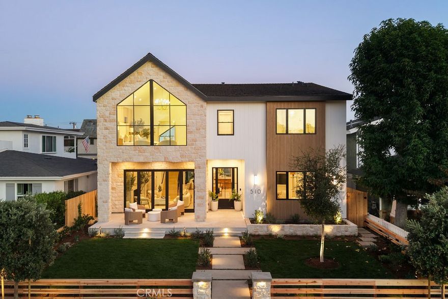 Incomparable quality and modern luxury take center stage in this just-completed masterpiece. Meticulously crafted by Well Done Building & Design, with interiors curated by LL Design Co., this incredible 2025 build showcases architectural brilliance and authentic elegance in the heart of Newport Heights. Step into the gorgeous interior where natural light floods across wide-plank hardwood floors and striking fireplaces set the mood for nights of entertaining or unwinding. The flexible main level offers two en-suite bedrooms—ideal for guests or a private office—while open living areas strike the perfect balance between sophistication and daily livability. The chef’s kitchen is a true centerpiece, featuring a waterfall-edge center island with ample seating, a butler’s pantry for seamless prep, and high-end finishes that make every meal an experience. Upstairs, an oversized open entertainment area acts as an additional living room, game zone, or media space. The primary suite is your sanctuary, where double walk-in closets, a magazine-worthy bath with a custom framed shower, high ceilings, massive windows, and luxe finishes promise resort-level relaxation. Every bedroom is en-suite and thoughtfully designed. Dual laundry rooms and multiple fireplaces add convenience and comfort at every turn. The entire property is enhanced by Chelsea Corinne Studio’s stunning landscaping—warm and welcoming in the front, and private and serene in the back, where a custom spool creates the ultimate retreat. Enjoy an unparalleled lifestyle in a highly sought-after neighborhood, just minutes from beaches, Fashion Island, Lido Marina Village, Newport Harbor, and the nation’s most esteemed public and private schools.