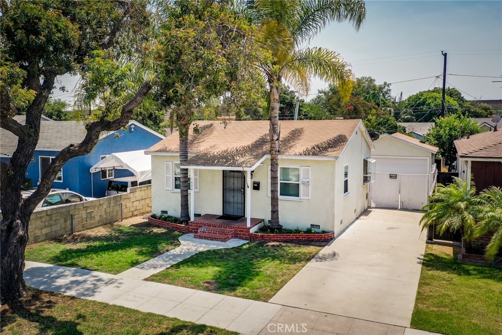 The prettiest little starter home in N. Long Beach that also has some pretty cool hidden potential....why??? 1434 E 68th sits forward on its large lot with separate alley access behind it. With a two car garage, a covered patio and the home's large private yard many neighbors have already realized that they can add an ADU, a Junior ADU or simply expand their homes. Check with the city for details but who doesn't love having that potential? Speaking of potential, the home also has an additional permitted step down patio room (approx. 285 sf) that was enjoyed by its current owners as a huge 3rd primary bedroom "or" it could just be a bonus room. Freshly painted and featuring an updated full bath, dual pane windows throughout, a sunny garden window, convienient raised foundation, a detached 2 car garage with roll up door and a pretty covered patio for enjoying supper outside on a warm summer evening. Conveniently close to markets, Target and a variety of restaurants. A single family home at a condo price AND without HOA dues or rules, who doesn't love that!